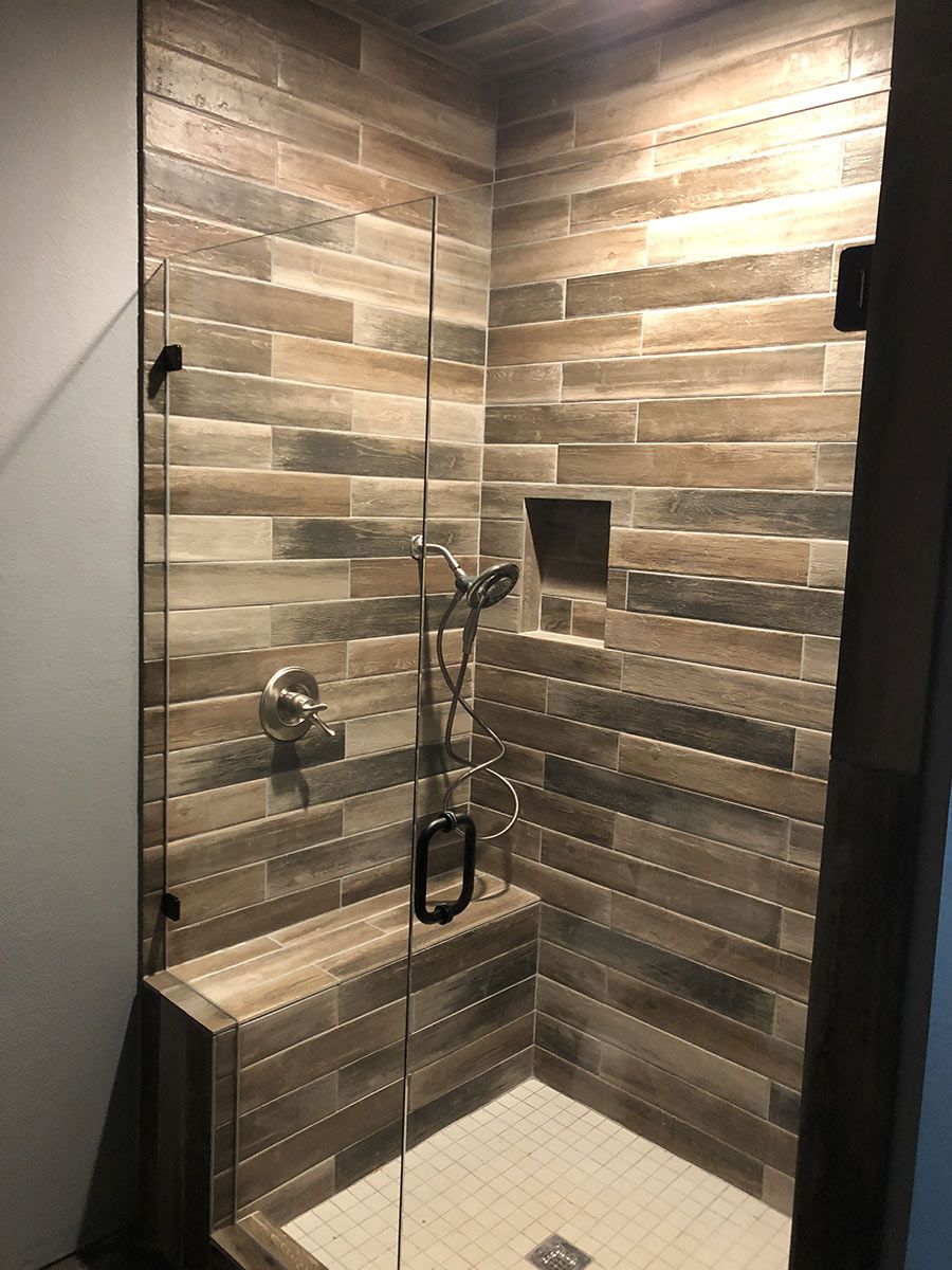 Glass and tile shower by Bobby Wolfe Construction