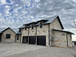 Closer view of 3-car garage and second story above