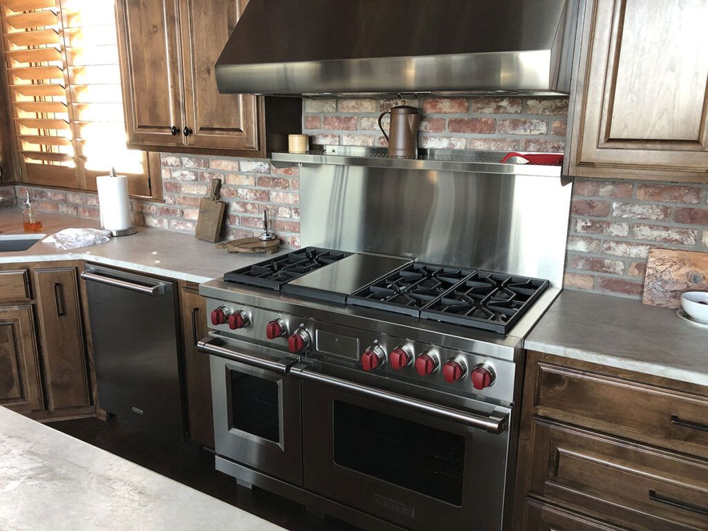 Installation of large gas range/ovens and kitchen remodeling